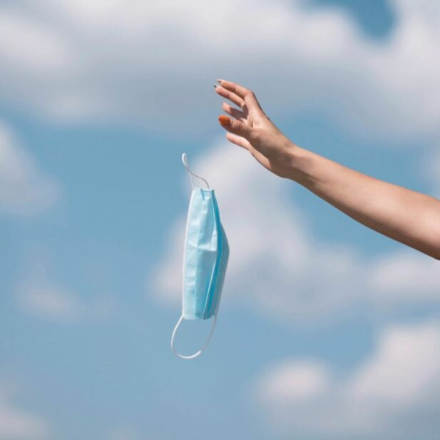 girl-throwing-out-medical-mask-1